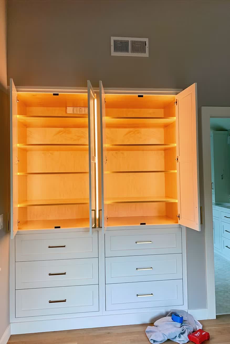 Custom built-in cabinetry with LED accent lighting and drawers